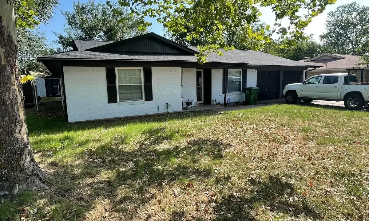 Professional roofing crew working on a residential roof in Sault Ste. Marie